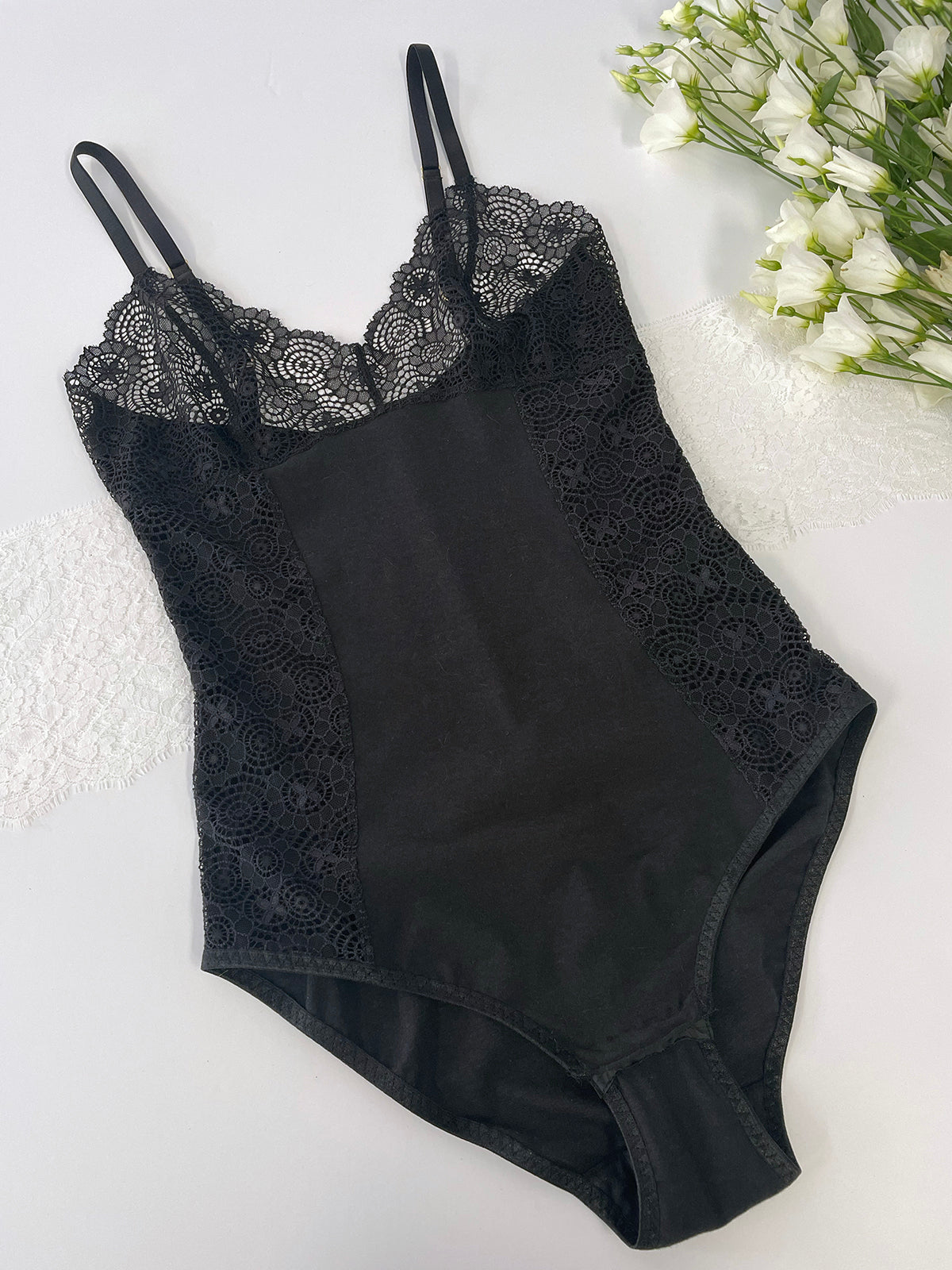 Flattering bodysuit with side lace detailing and eco-friendly materials