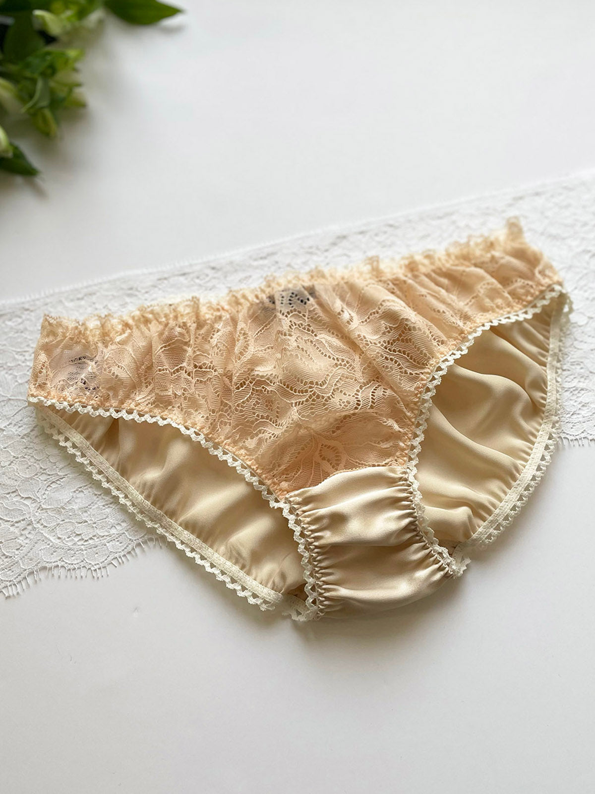 Peach knicker made from 100% silk with sustainably sourced Oeko-Tex-certified lace