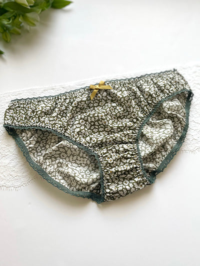 Liberty print knicker with organic cotton, green trim, and a gold bow detail.