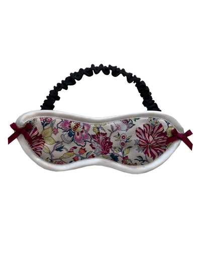 Elegant silk sleep mask made from Liberty London floral print silk crepe with breathable wadding and black silk lining